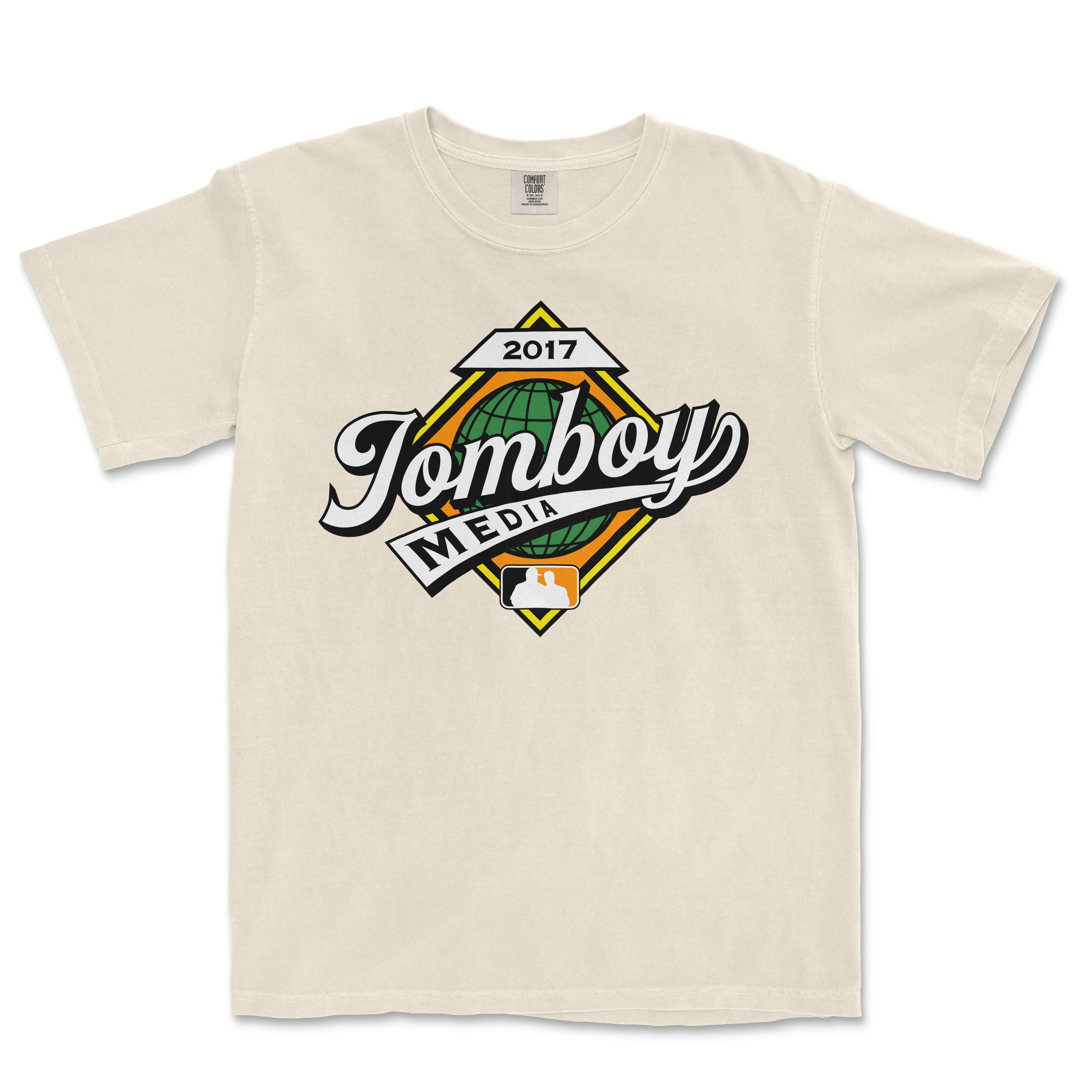 Beige Comfort Colors T-shirt featuring a colorful "Jamboy Media" logo with a globe, date 2017, and media icon in the center.