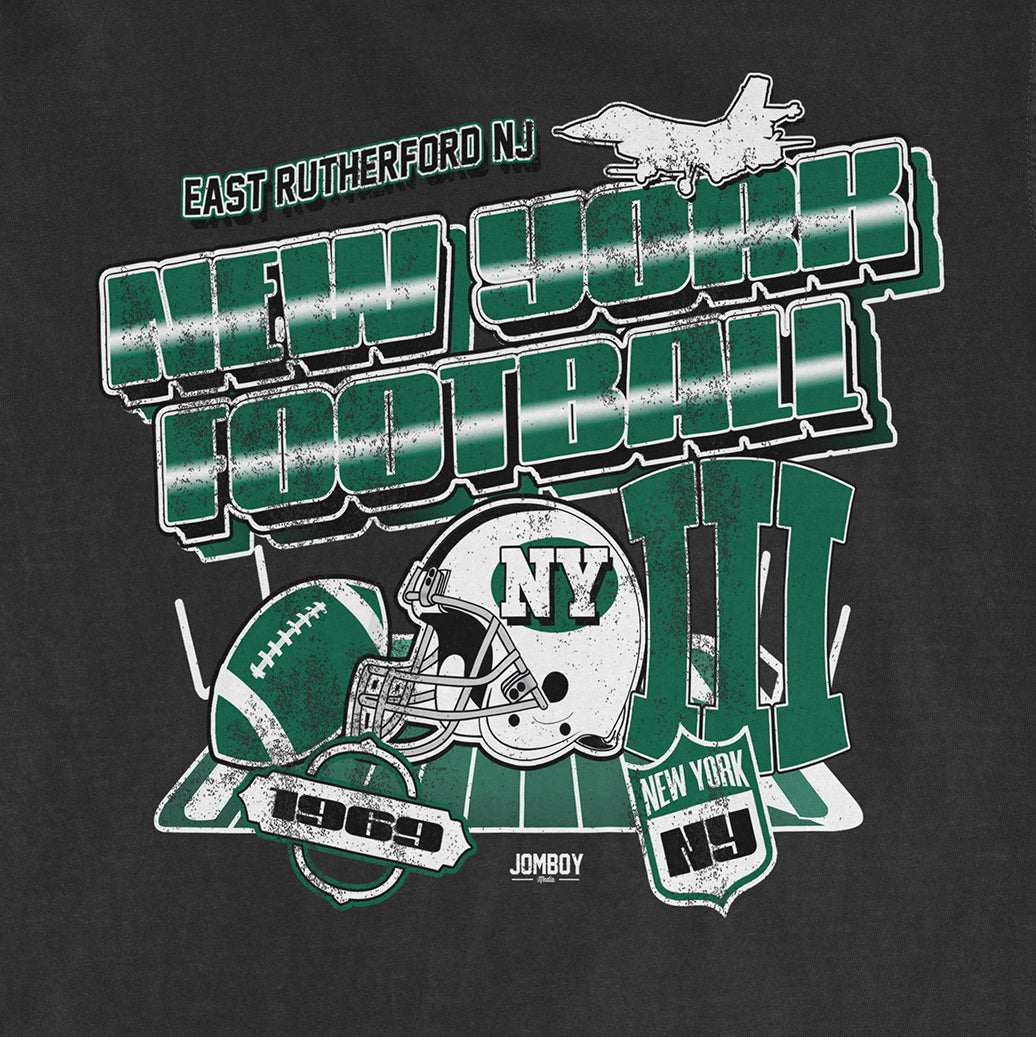Gray Comfort Colors® T-shirt featuring green and white New York Jets football graphics, helmets, and text for East Rutherford, NJ.