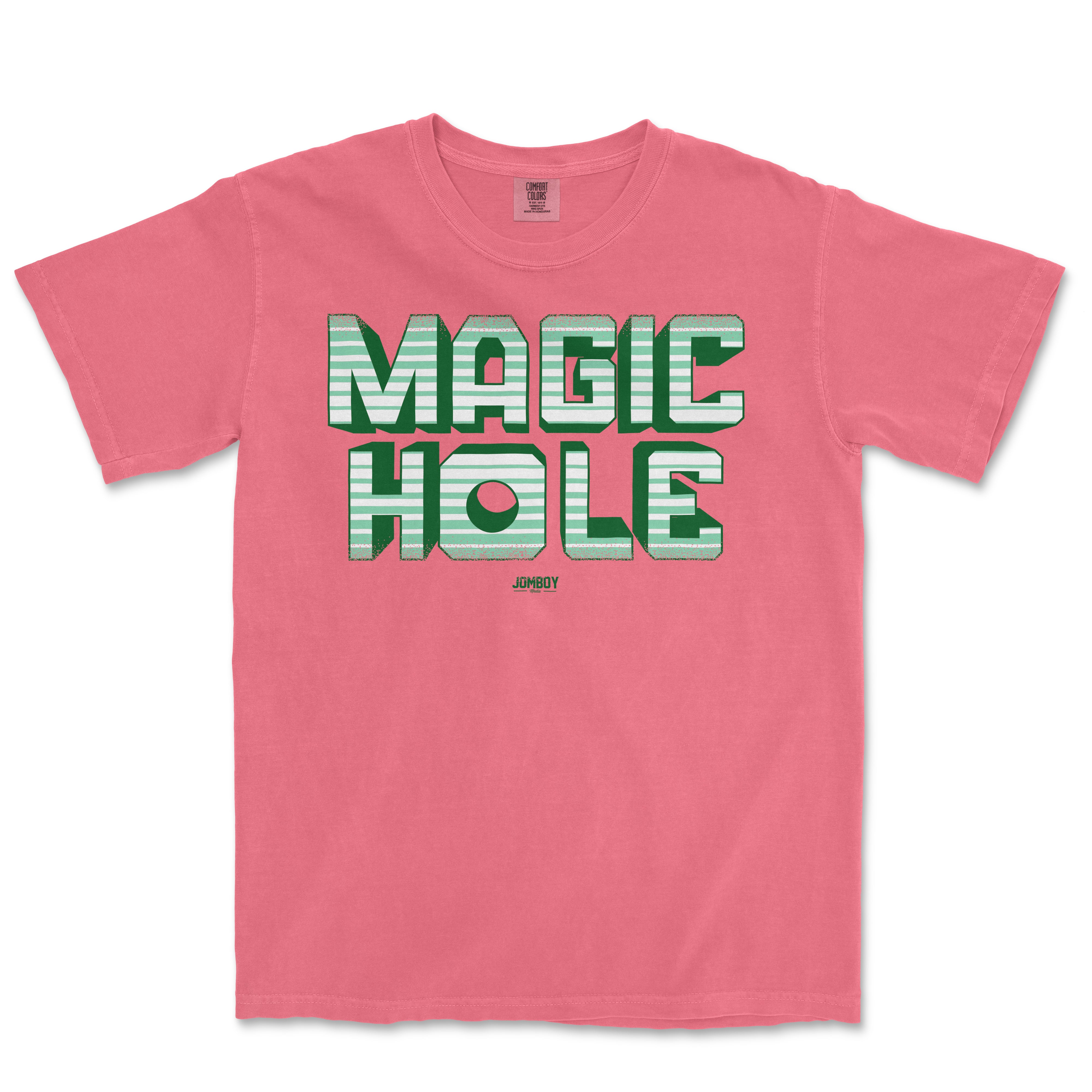 Pink vintage Comfort Colors® T-shirt featuring bold, striped "Magic Hole" graphic text and small "Jumboy" logo below.