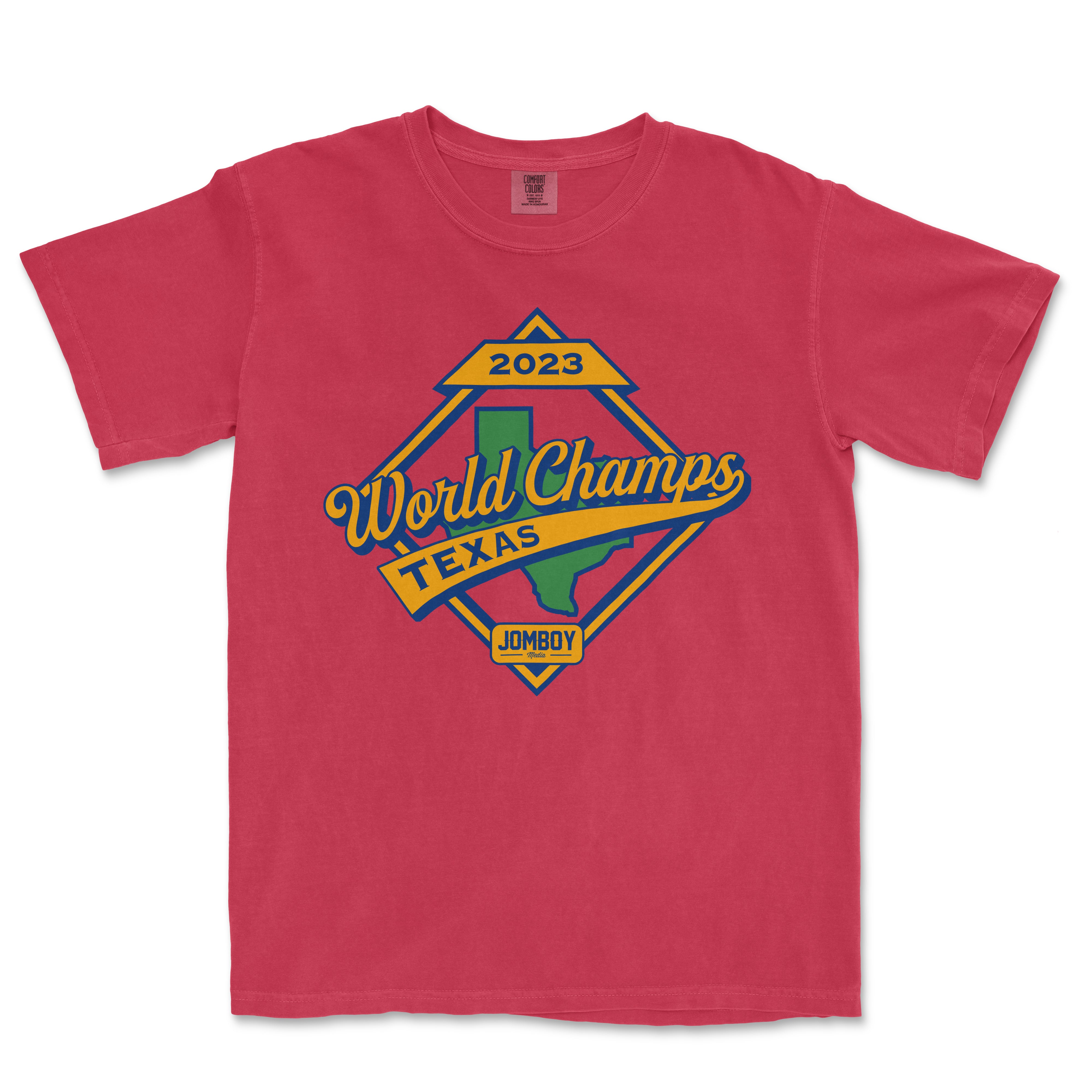 Red T-shirt featuring a vintage-style graphic design celebrating the 2023 World Champs in Texas, with a green outline of Texas and "JOMBOY" logo.
