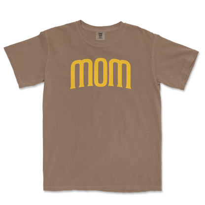 Beige T-shirt with the word "mom" in large, yellow, stylized font across the front, celebrating a San Diego baseball mom.