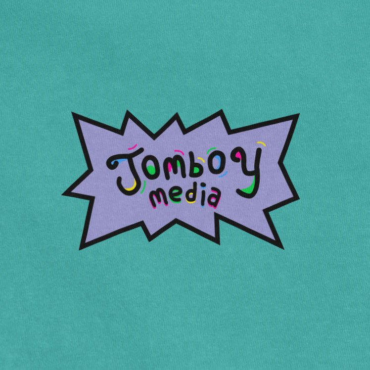 Comfort Colors tee featuring a colorful "Jumboy media" logo inside a purple comic-style speech bubble on a teal background.