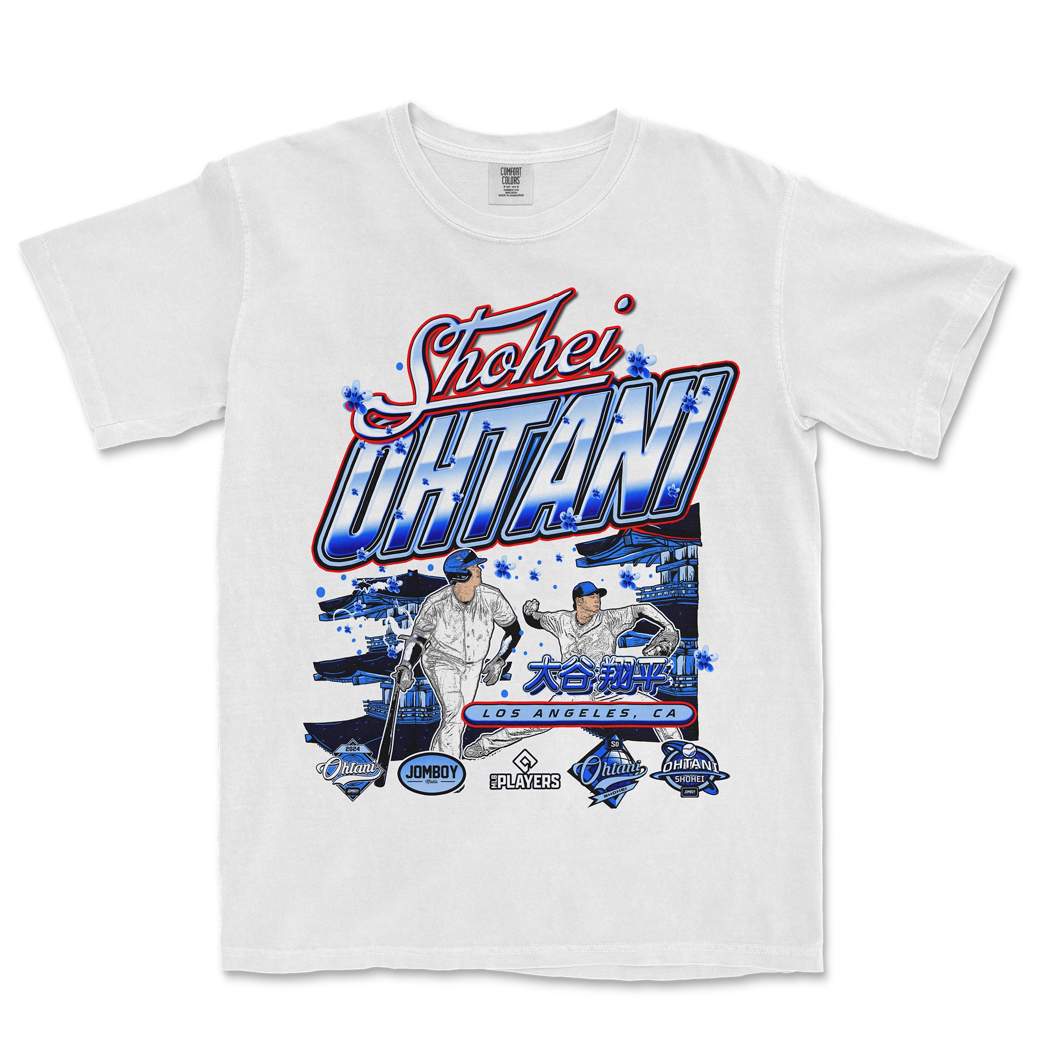 White T-shirt featuring a colorful graphic design of Shohei Ohtani, with images of him playing baseball, Japanese characters, and Los Angeles, CA text.