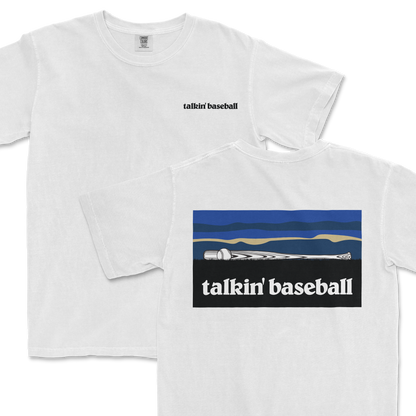 White T-shirt with "talkin' baseball" text on the front and a graphic of a baseball bat and ball on the back, outdoors theme.