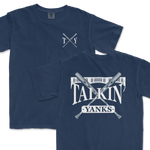 Navy blue Comfort Colors t-shirts featuring '97 Inspired Talkin' Yanks design with crossed baseball bats and stadium illustration. One shirt displays a large graphic on the front while the other has a smaller logo on the left chest area.