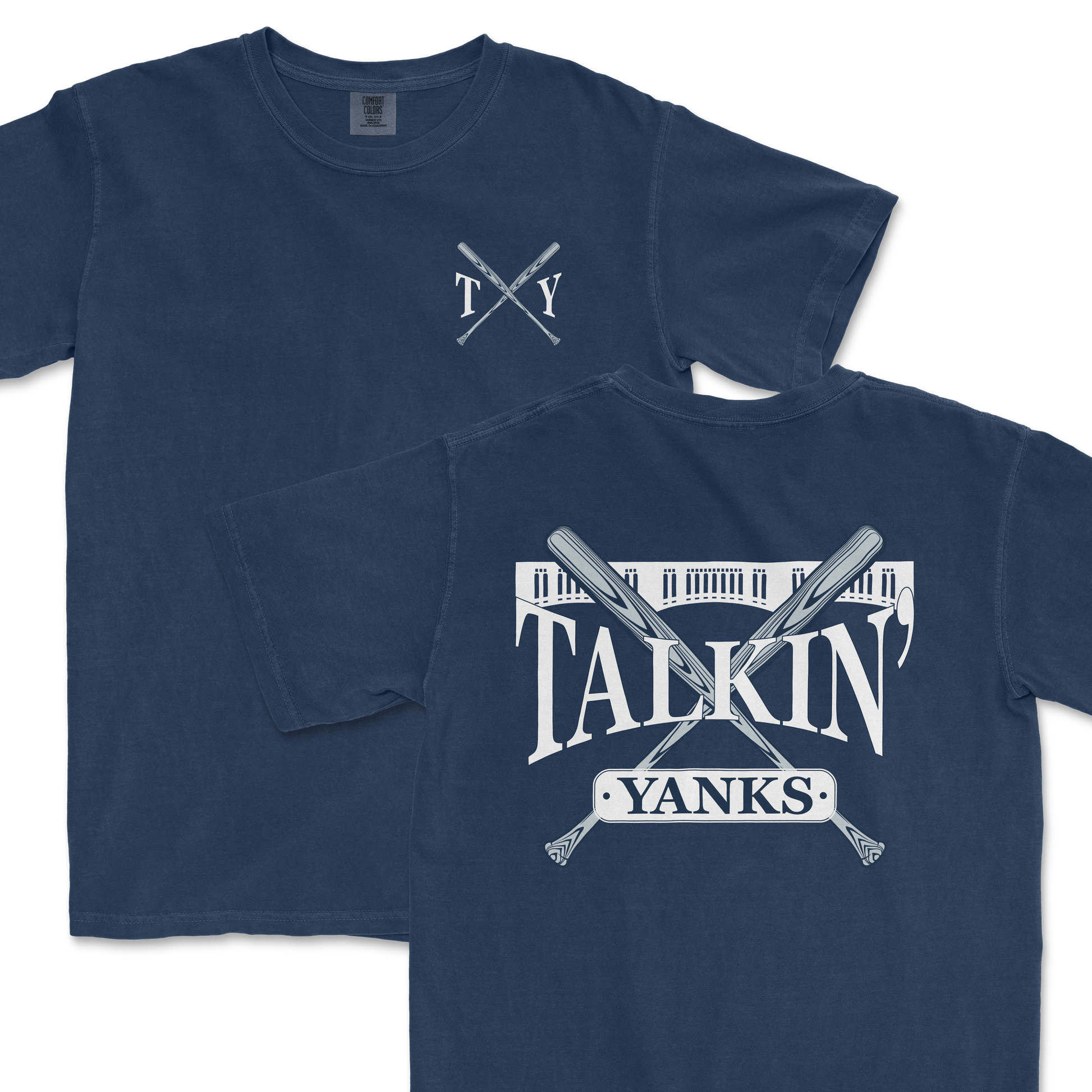 Navy blue Comfort Colors t-shirts featuring '97 Inspired Talkin' Yanks design with crossed baseball bats and stadium illustration. One shirt displays a large graphic on the front while the other has a smaller logo on the left chest area.