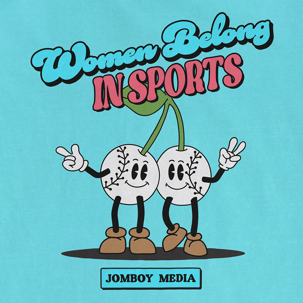 Illustration of two smiling baseballs with arms and legs, holding peace signs, with text "Women Belong in Sports" and "JomBoy Media" on a blue background.