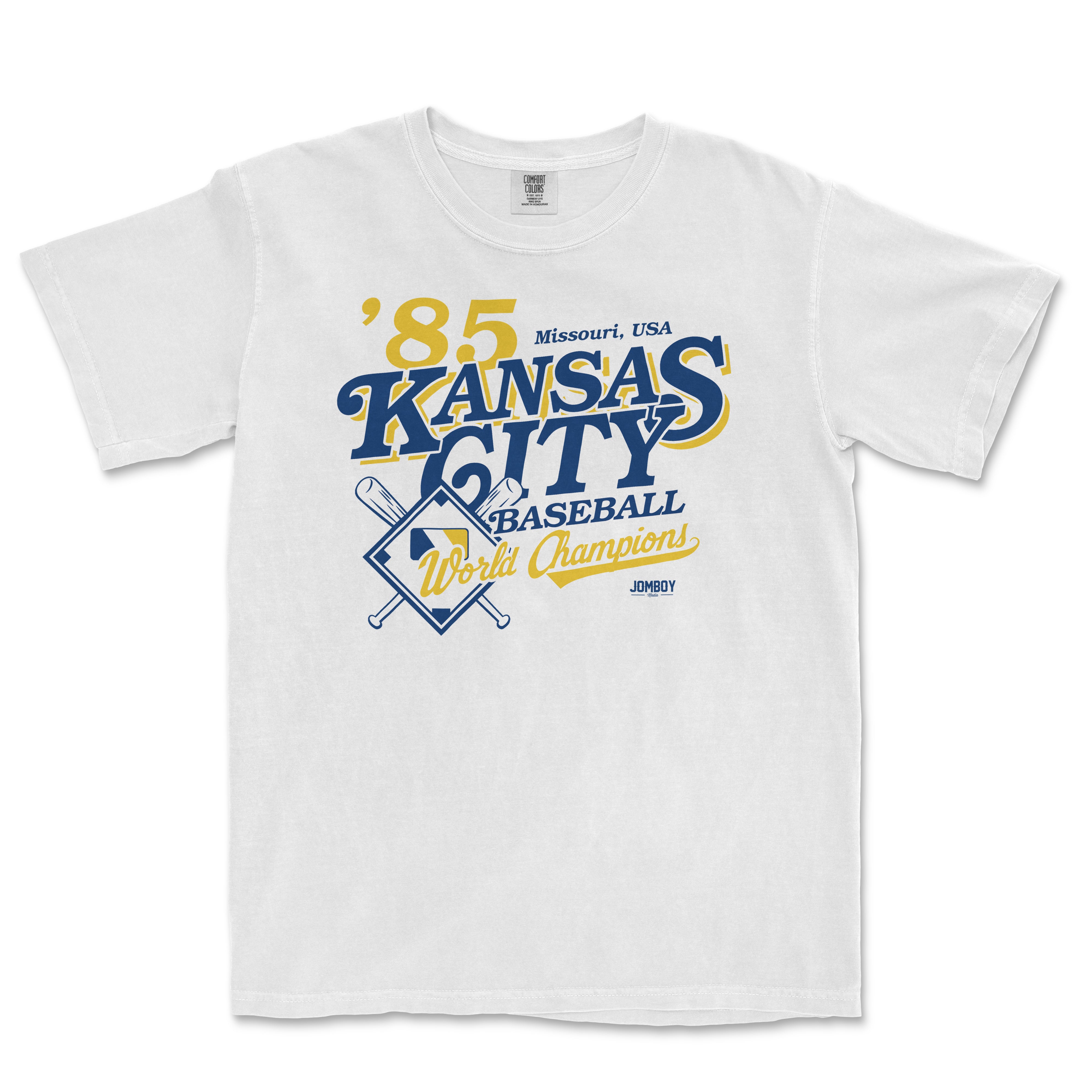 White Comfort Colors T-shirt featuring vintage Kansas City baseball team design with text, crossed bats, and "World Champions" banner.