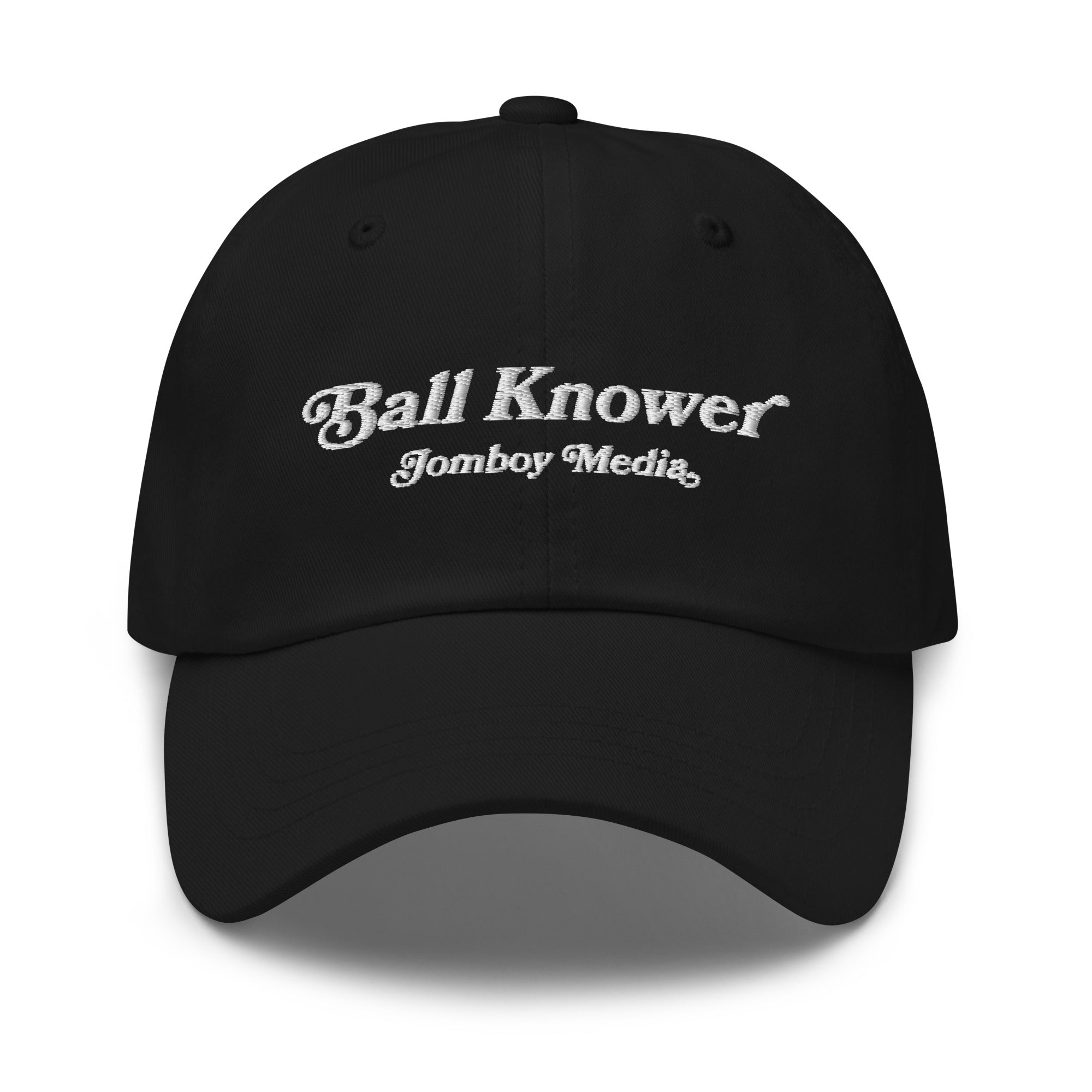 Black dad hat with white embroidered text reading "Ball Knower" and "Jomboy Media" on the front.