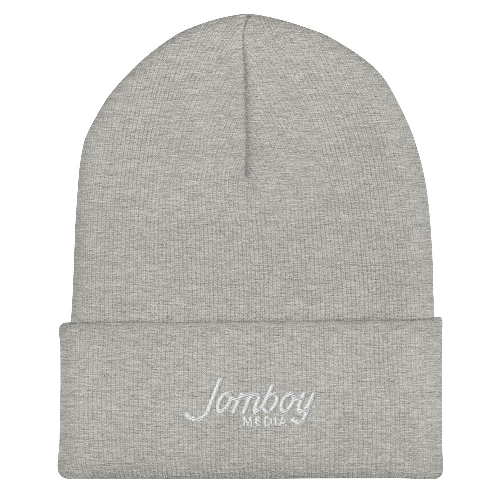 Light gray beanie with "Lomboy Media" embroidered on the folded cuff, featuring a simple, stylish design.