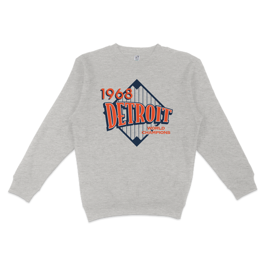 Gray crewneck sweatshirt featuring a vintage Detroit 1968 World Champions graphic with a diamond shape and bold red and navy text.