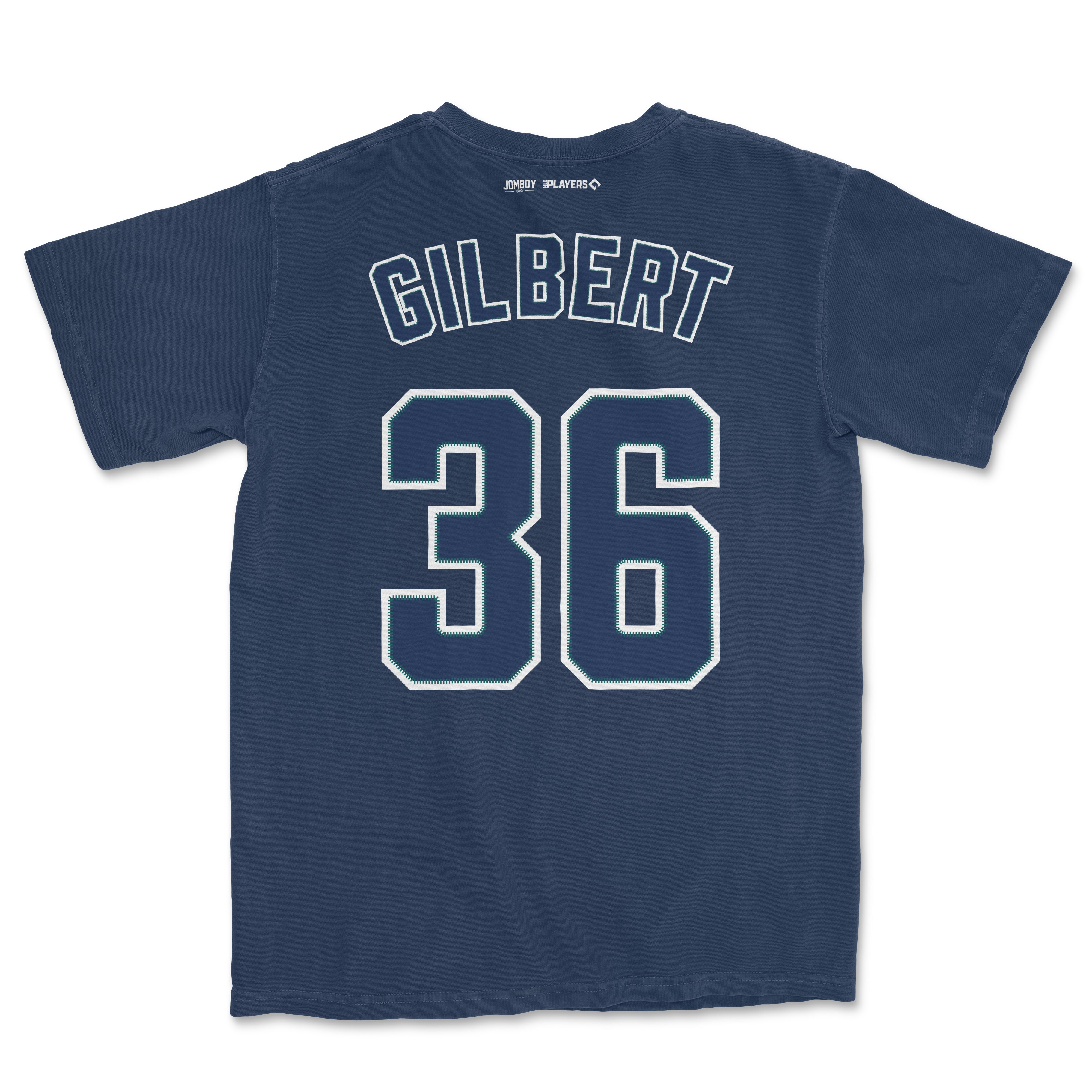 Back of navy blue Comfort Colors tee featuring "Gilbert" and the number "36" in white with green accents, and small brand logos at the top.