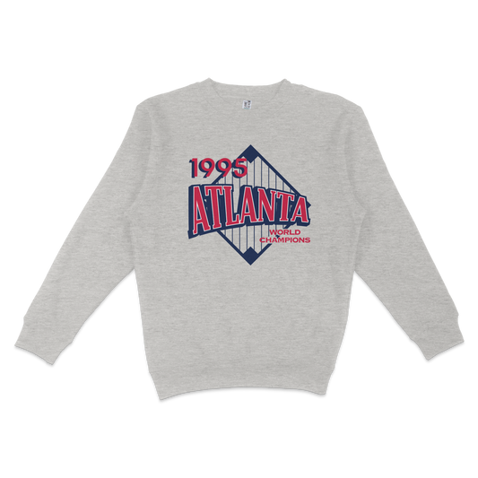 Gray crewneck sweatshirt featuring a vintage-style graphic of the 1995 Atlanta skyline with "World Champions" text.