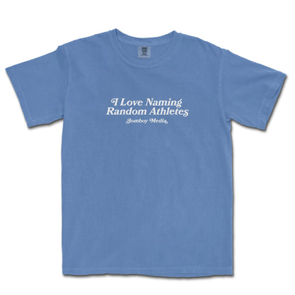 Blue Comfort Colors T-shirt with white text that reads "I Love Naming Random Athletes" and "Jomboy Media" underneath.