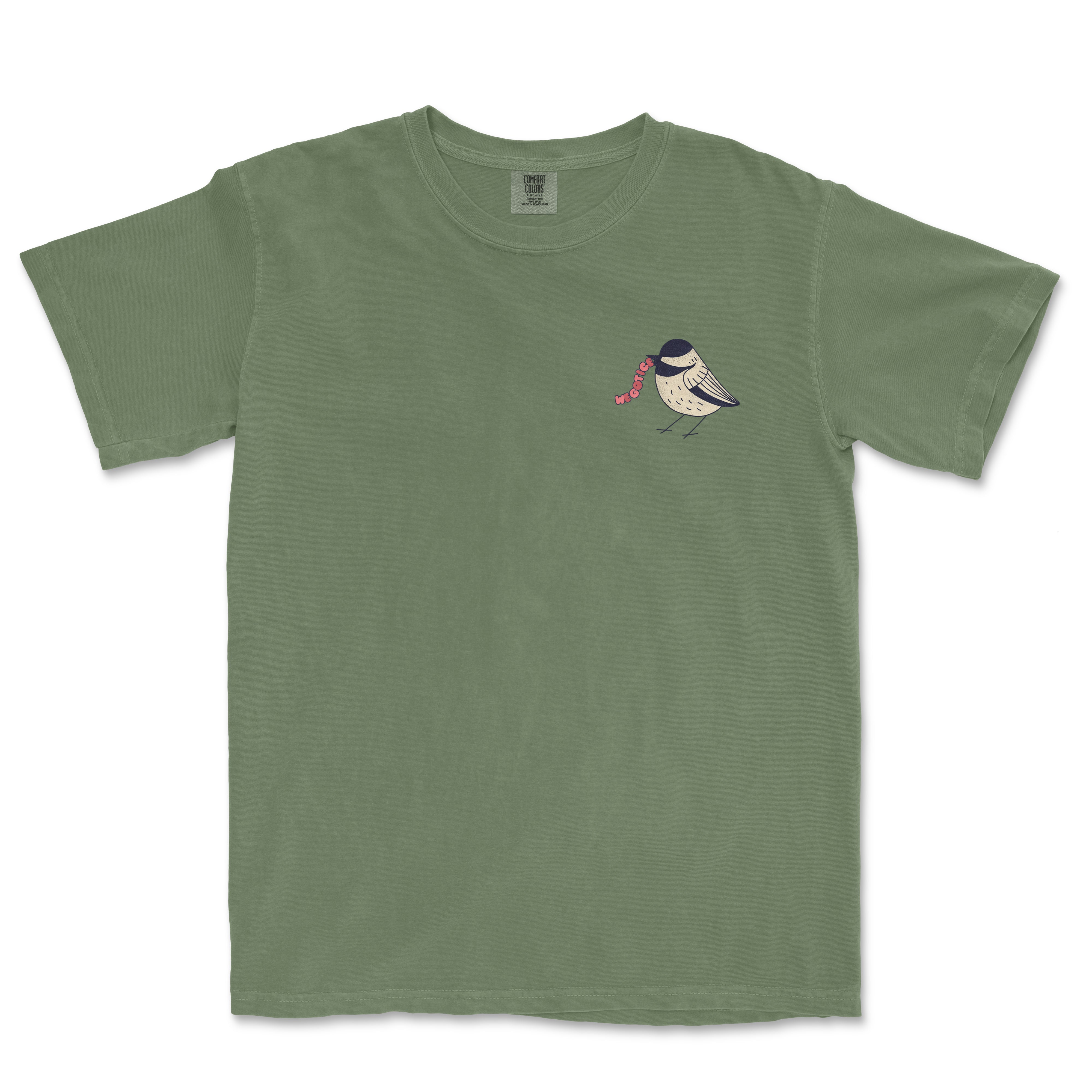 Green Comfort Colors vintage t-shirt featuring a small bird illustration with the text "Worms" on the chest.