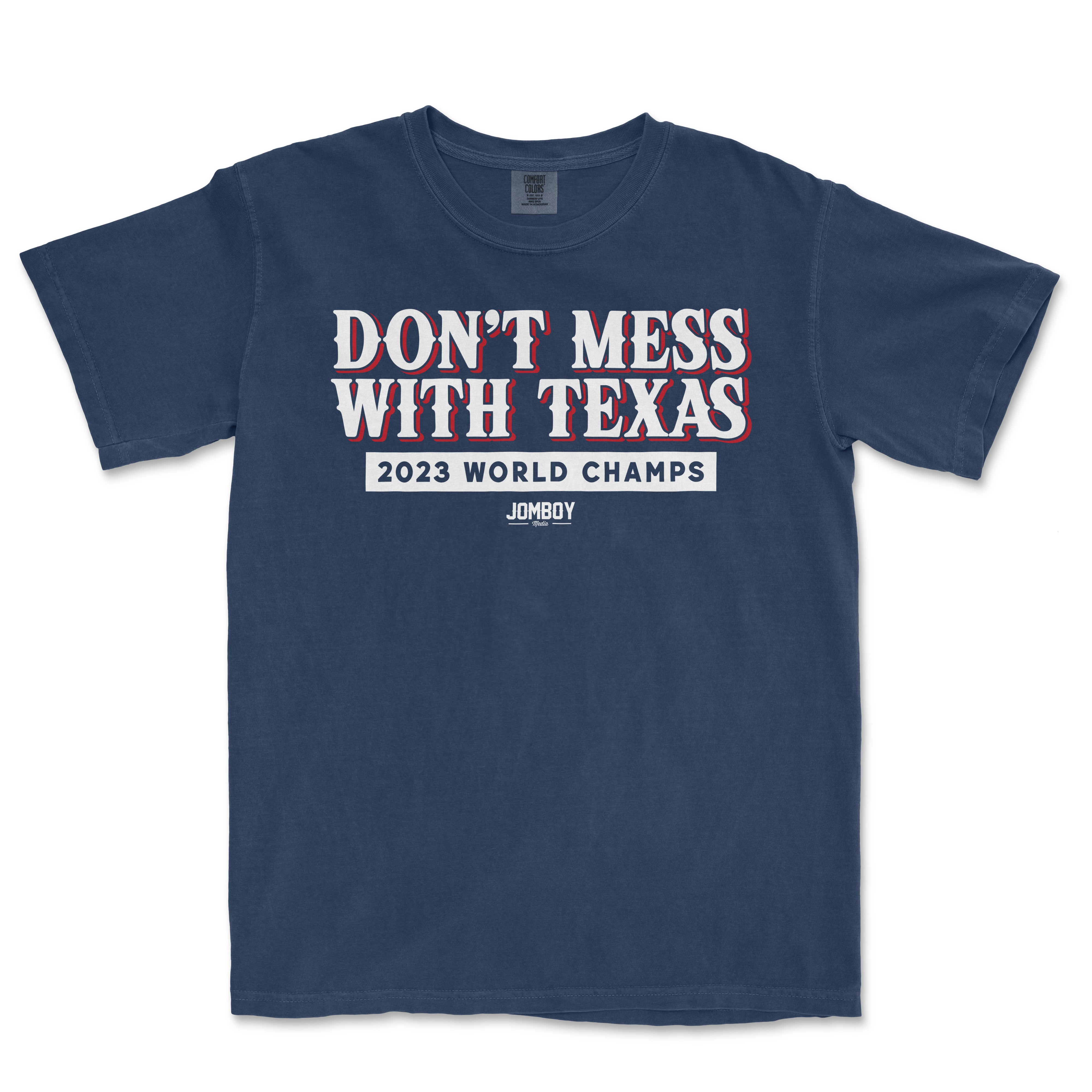 Comfort Colors T-shirt featuring "Don’t Mess With The Champs" slogan, "2023 World Champs," and Jomboy logo in white and red on navy fabric.
