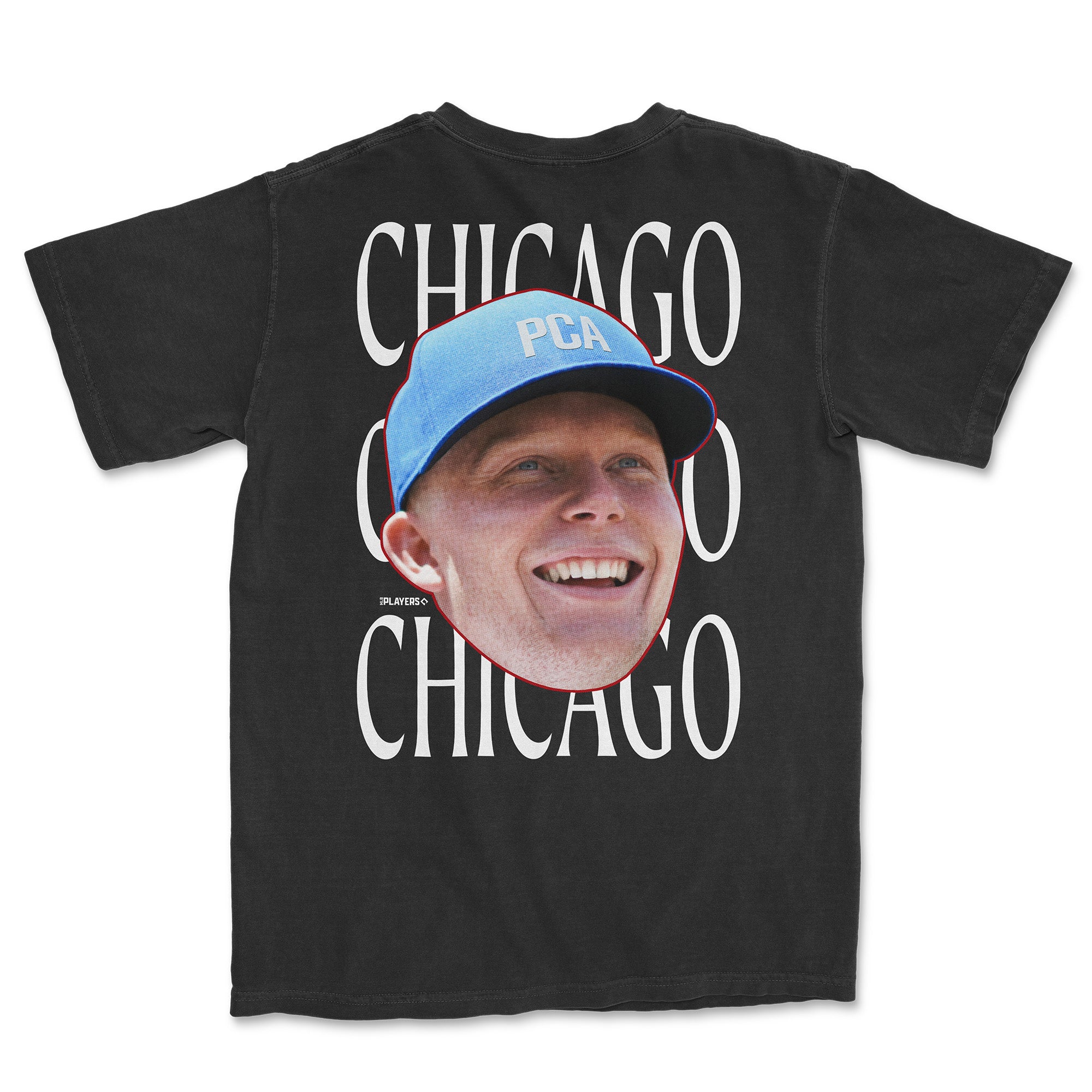 Black t-shirt featuring a large smiling face graphic and "Chicago" text repeated on the back, promoting PCA series.