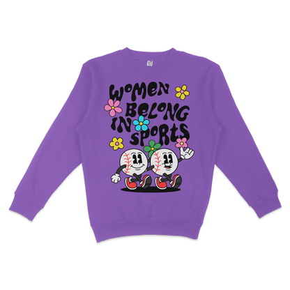 Purple sweatshirt featuring cartoon baseballs with smiling faces, colorful flowers, and the text "Women Belong in Sports.