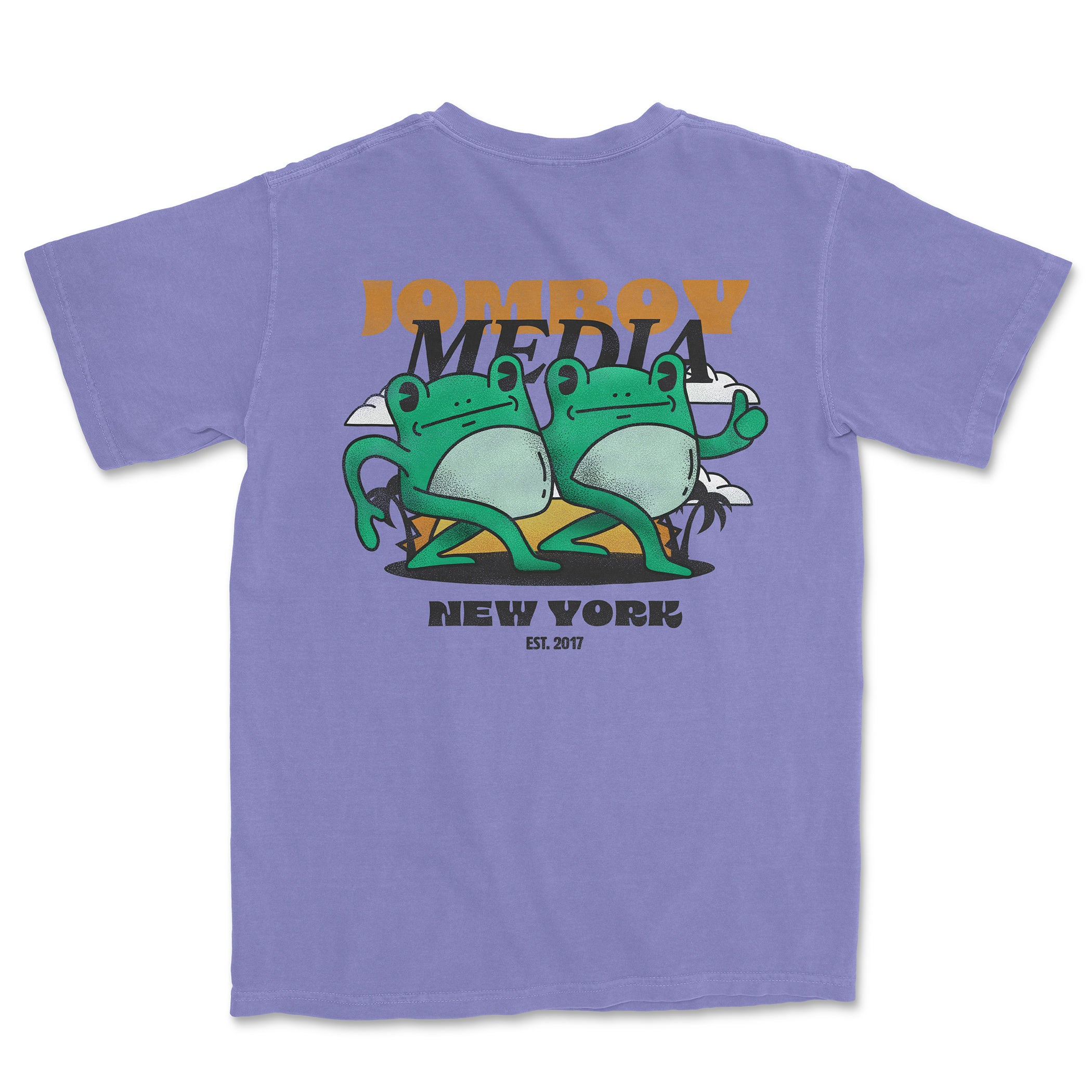 Comfort Colors lavender tee featuring a graphic of two frogs, "Jombo" and "Media" text, and "New York" with establishment date.