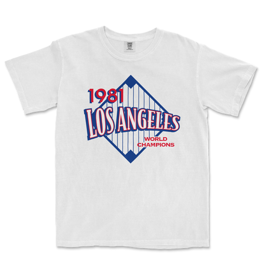 White Comfort Colors tee featuring a vintage Los Angeles 1981 World Champions graphic with red, blue, and white design elements.