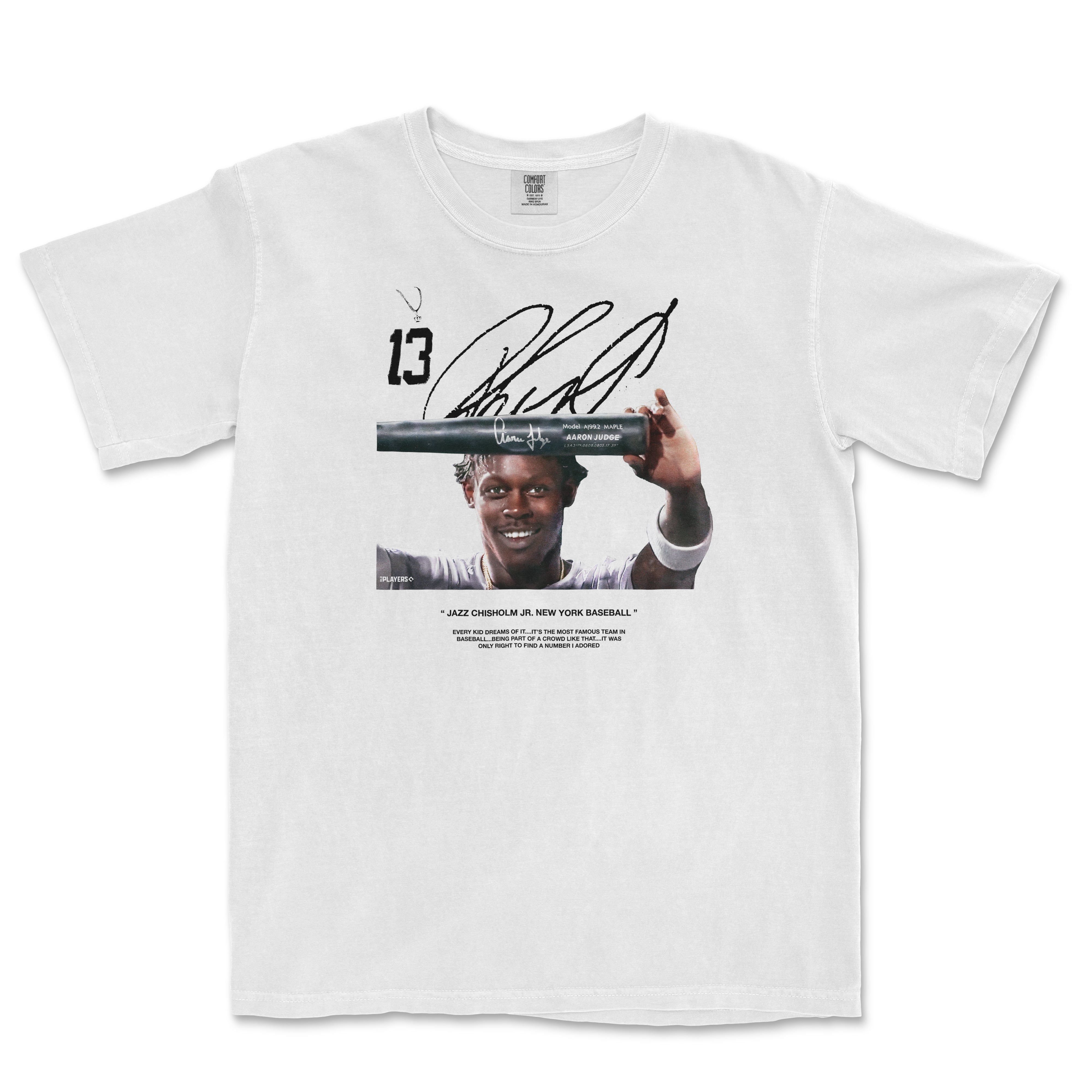 White Comfort Colors T-shirt featuring a baseball player holding a bat, with autograph and text about a baseball team.