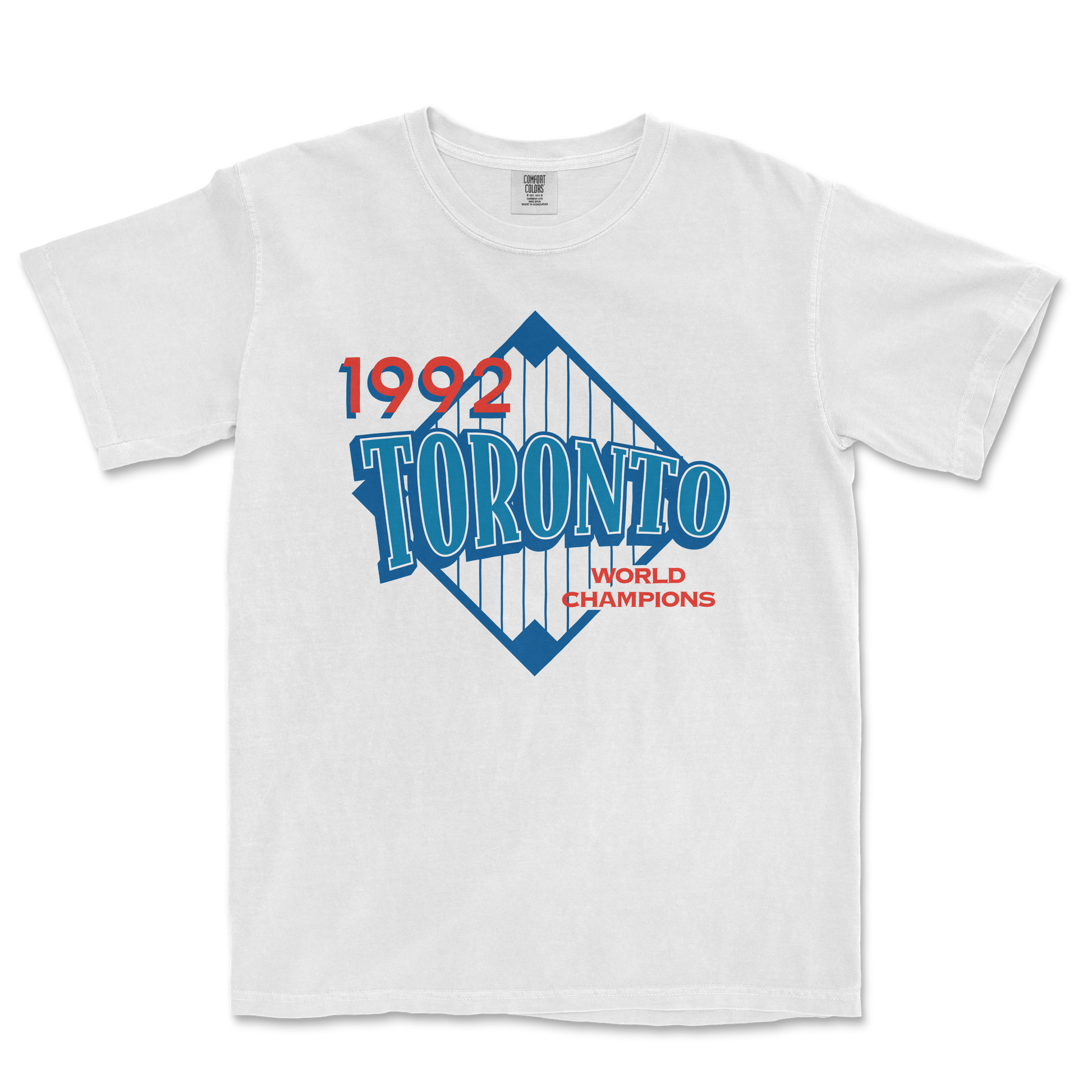White T-shirt featuring a vintage Toronto 1992 World Champions graphic with blue, red, and white colors and a diamond-shaped design.
