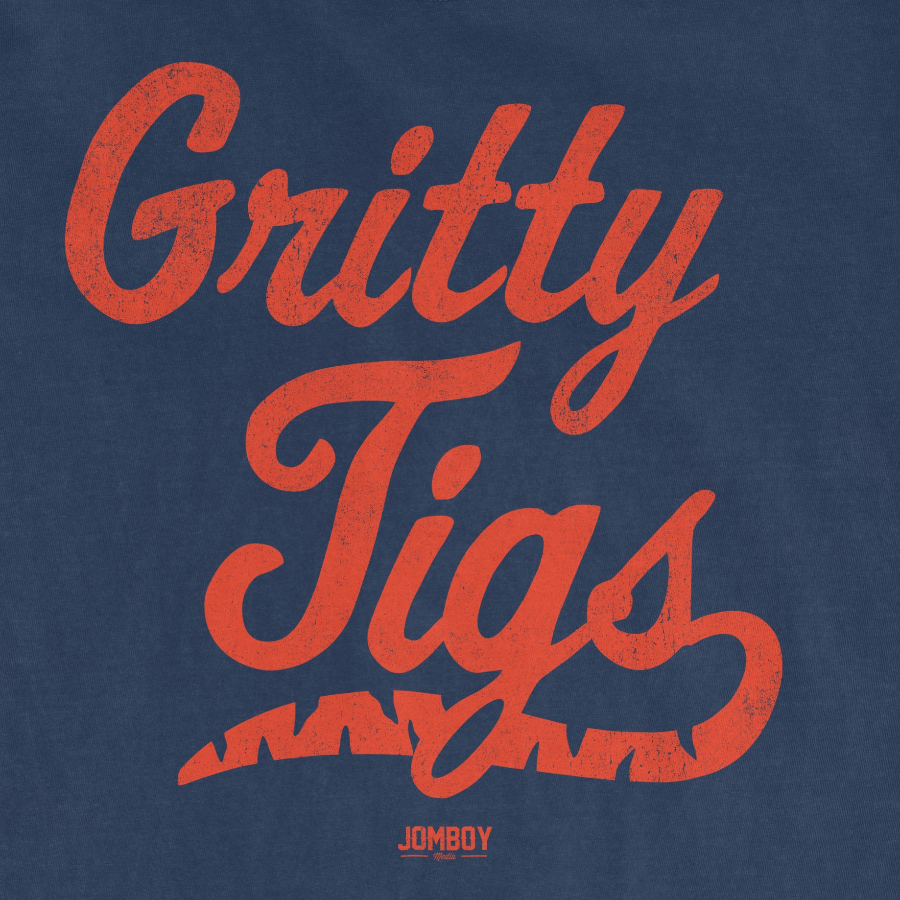 Comfort Colors tee featuring the phrase "Gritty Tigs" in bold, distressed red text with a small "JOMBOY" logo below on a blue background.