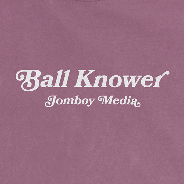 Pink Comfort Colors T-shirt with white text reading "Ball Knower" and "Jomboy Media" underneath.