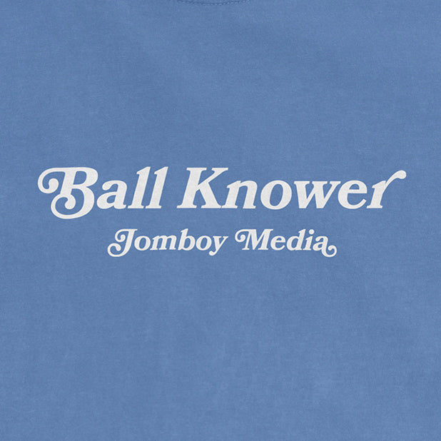 Blue Comfort Colors T-shirt with white text reading "Ball Knower" and "Jomboy Media" underneath.
