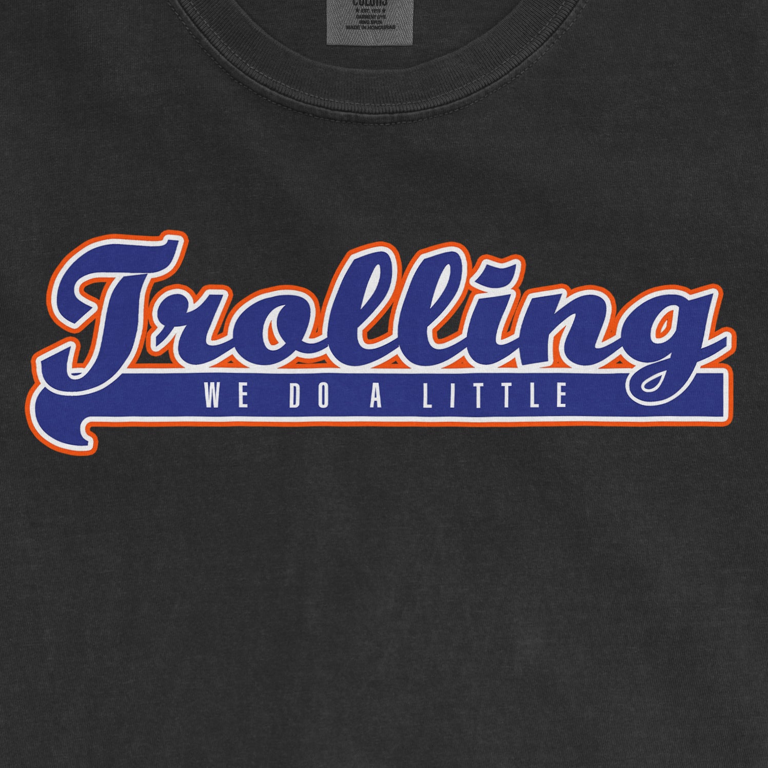 Black T-shirt with bold "Juggling" text and "We Do A Little" slogan in blue, white, and orange lettering.