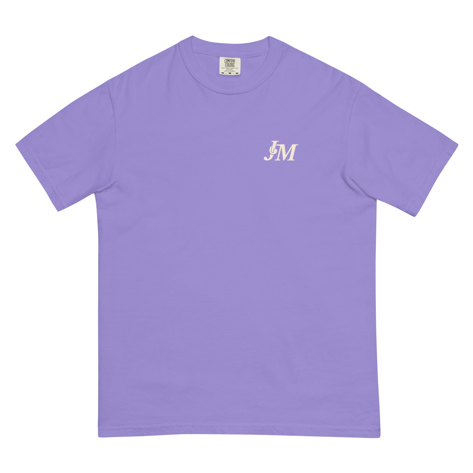 A lavender T-shirt featuring a small white "JM" logo on the upper left chest area.